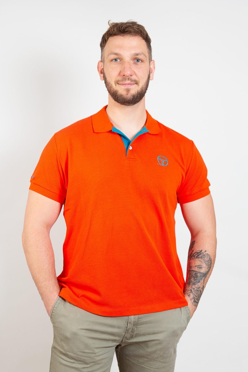 Polo Aube de vitesse orange homme – Volant 3 Ranches